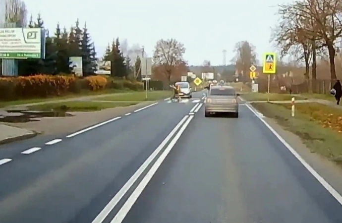 {Taką karę otrzymała kobieta jadąca samochodem osobowym.}